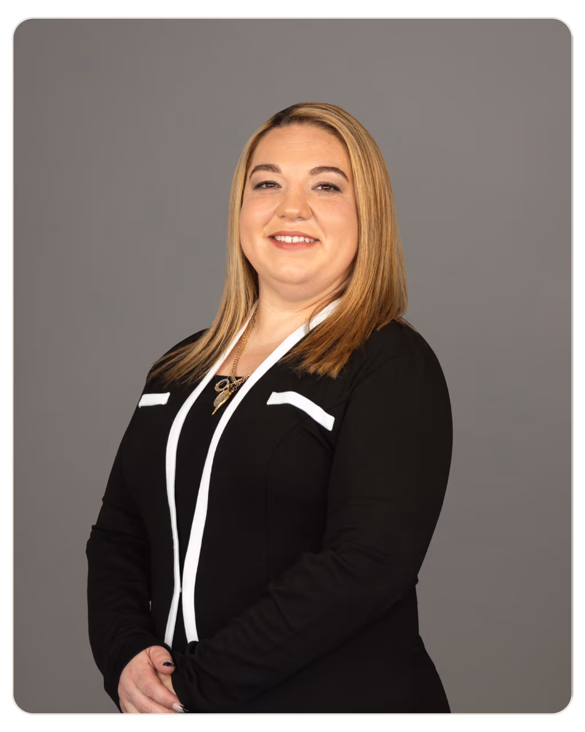 Frances Donato, RN: Director of Nursing at Daylight. Professional portrait of a smiling woman in a black blazer with white trim against a gray backdrop.