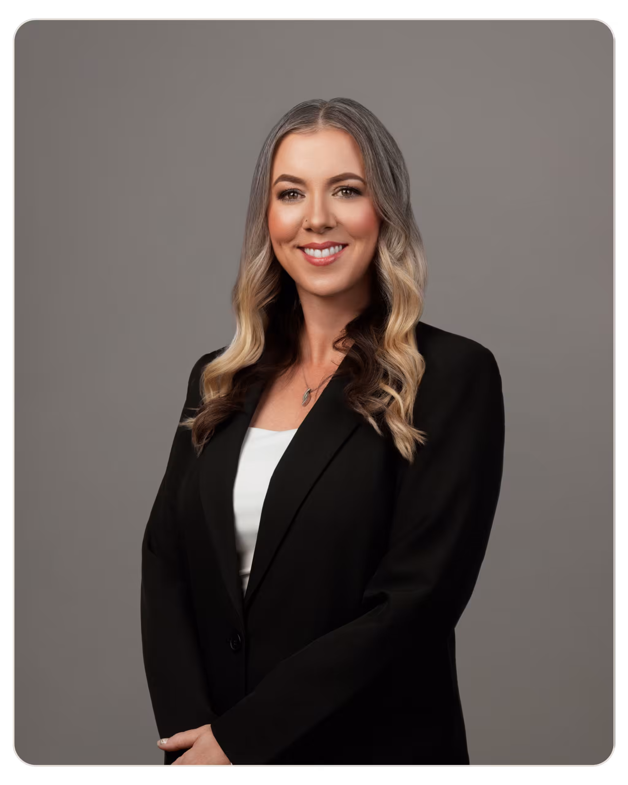 Kendra Cook, MA, LPCC: Clinical Director Kendra Cook, MA, LPCC: Clinical Director Professional headshot of a smiling woman with shoulder-length gray-blonde hair, wearing a black blazer over a white top, against a gray studio background.