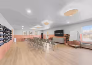 A group room with a wall of yoga mats